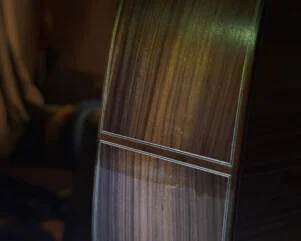 applying the seal coat on a guitar