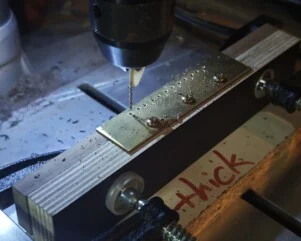precise string holes drilling on a bridge f classical guitar