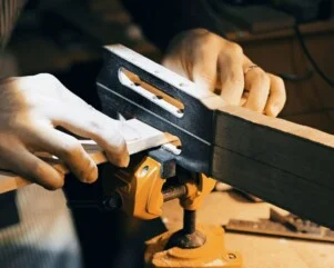 shaping headstock slots of a guitar